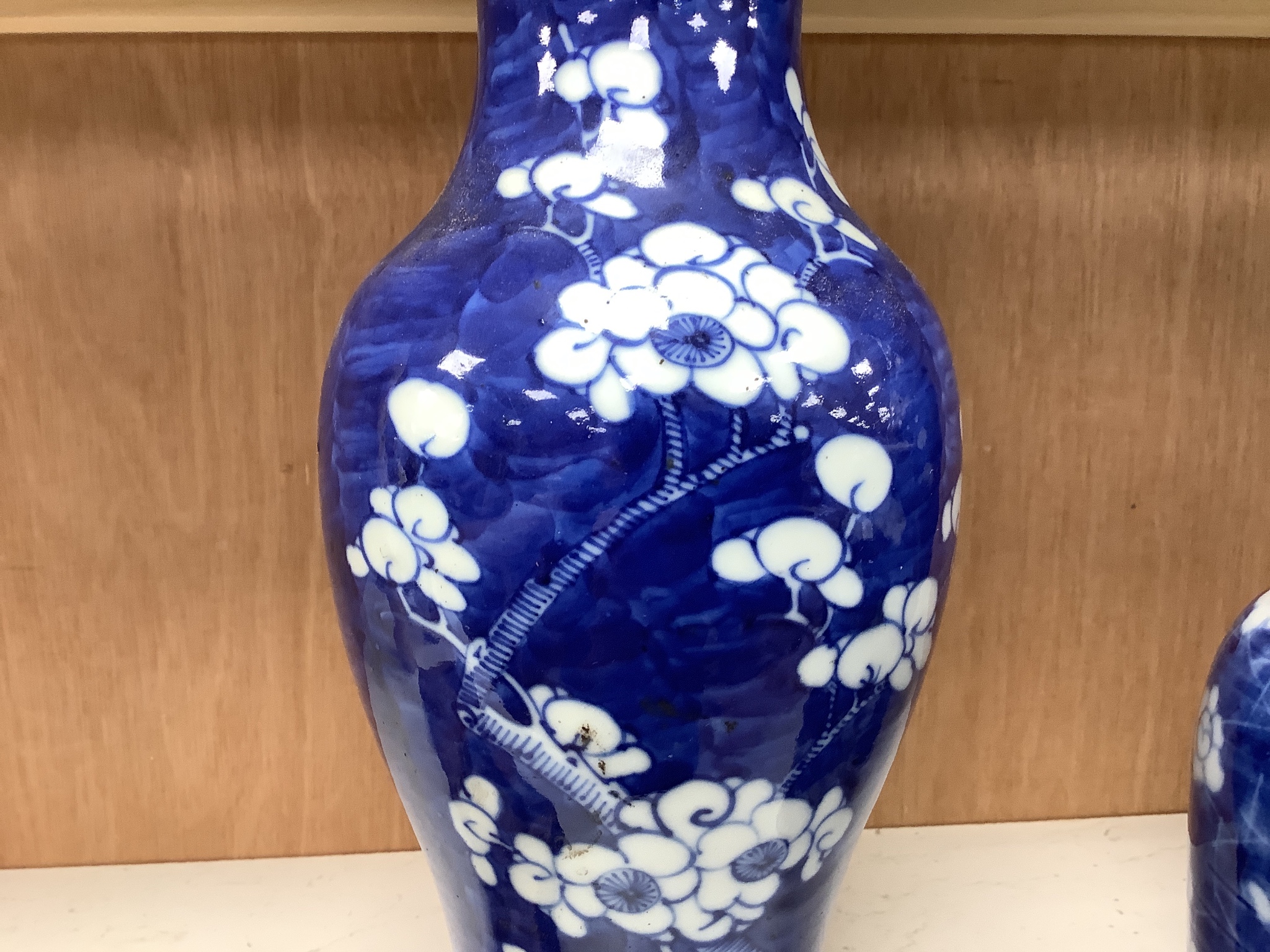 A pair of late 19th century Chinese prunus blossom baluster vases, 30cm, and a Japanese ovoid vase